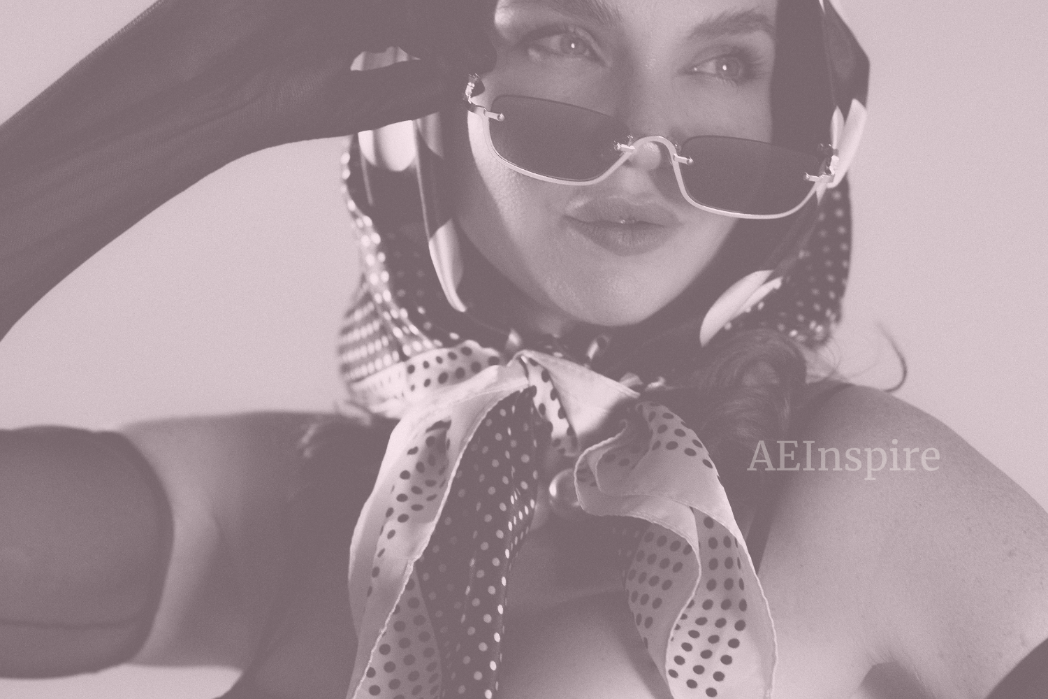 Elegant woman in retro-chic scarf and sunglasses – AEInspire editorial fashion image