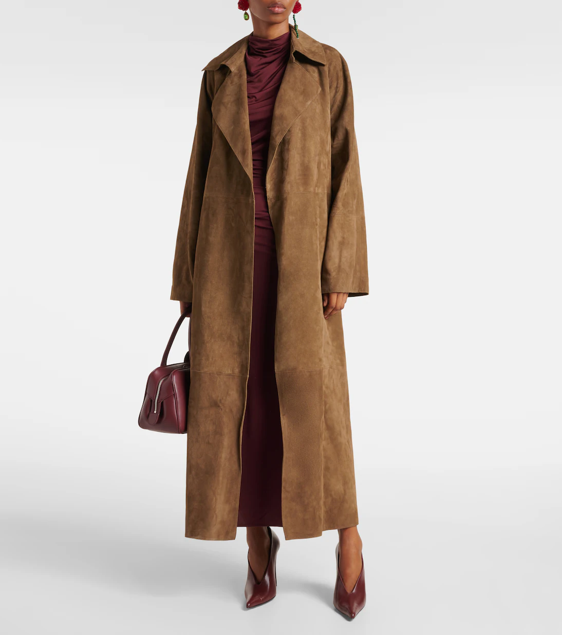 Elegant woman wearing a camel coat — fashion editorial image